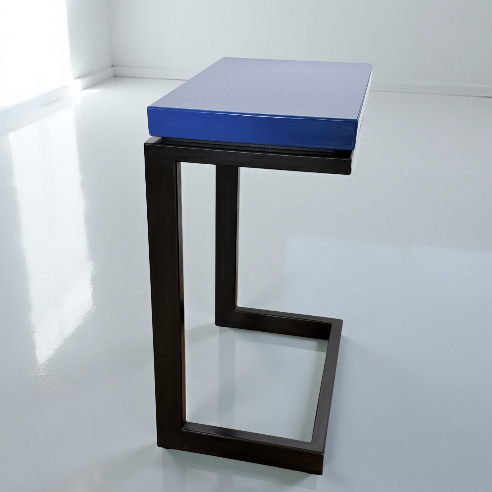 Modern laptop table featured in Blue Nocturne porcelain enamel with blued steel base.
