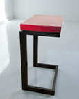 Modern laptop table featured in Heartthrob Red porcelain enamel with blued steel base.