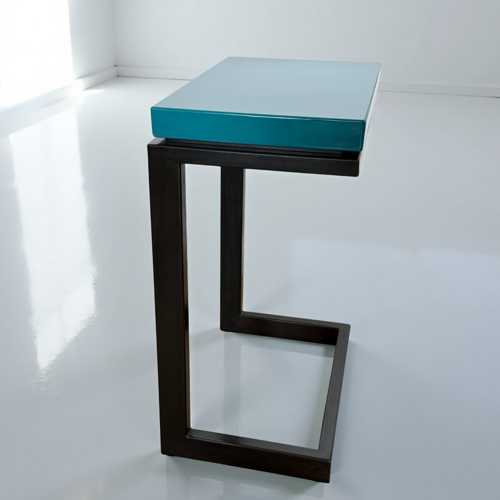 Modern laptop table featured in Oceanic Teal porcelain enamel with blued steel base.