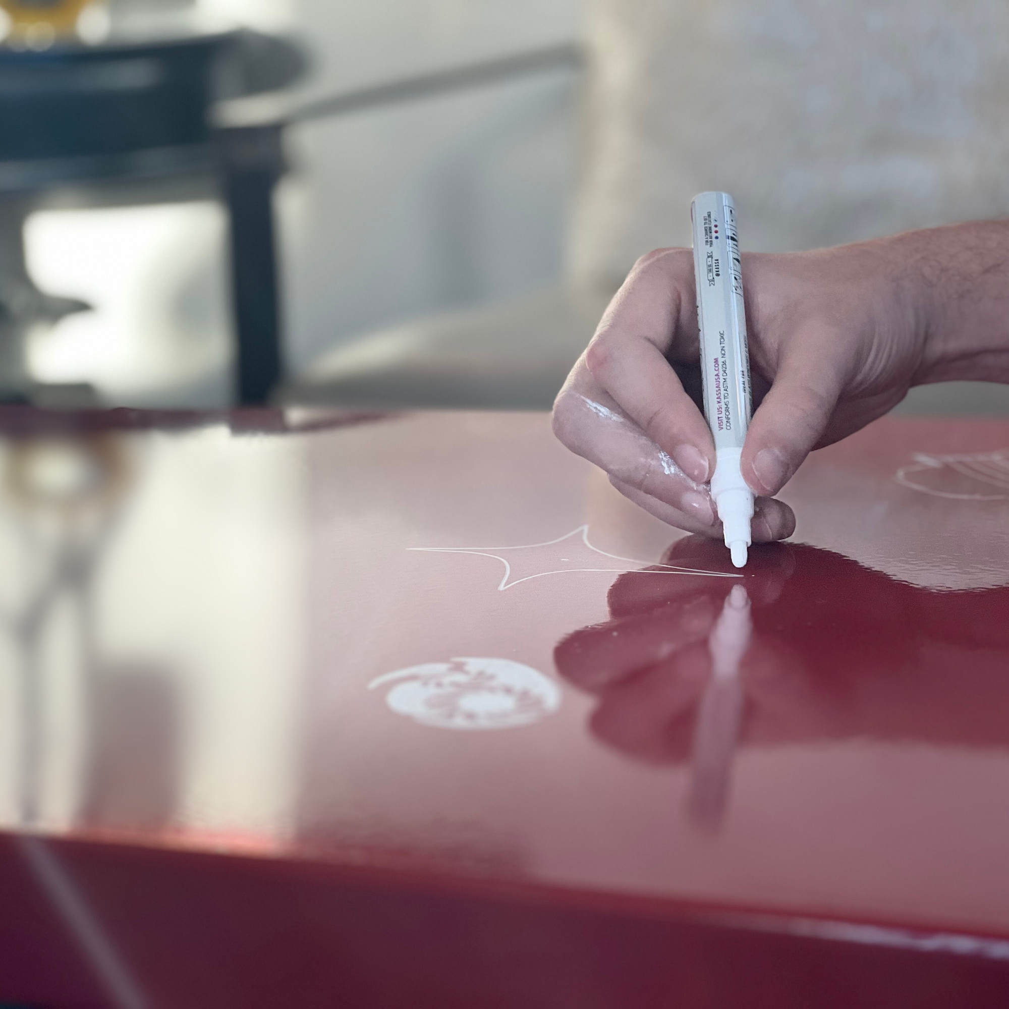 Wet erase marker used on Heartthrob Red side table with blued steel base and porcelain enamel top

